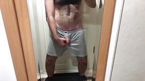 Hairy man magnify cock in front of the mirror