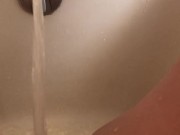Horny hot thick MILF wiggles hips and uses bath tub faucet to get off in bathtub