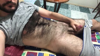 I'm getting ready to masturbate by stroking my hairy body
