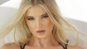 ”Satisfying blonde teen model passion posing action in hot black lingerie”