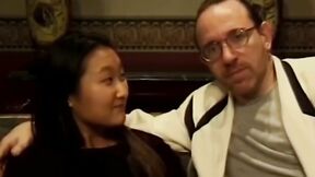 Sensual Asian teen has her butt screwed by two guys on couch