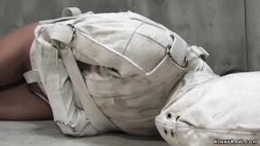 ”Brunette psycho bound in straitjacket”