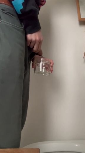 Amateur twink pisses alone in a bathroom
