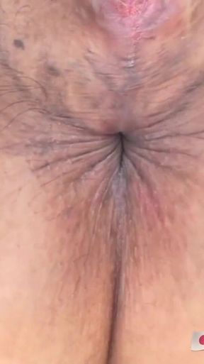 Japanese granny spreads her pussy wide