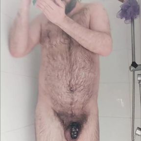 Chastity locked bear in the shower