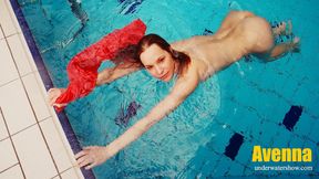 Adorable brunette teen swimming naked