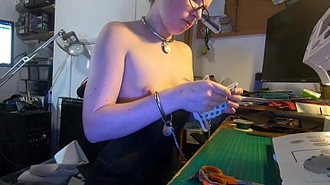 Dutifully working away sewing face masks while plugged and corseted, with a tight hobble skirt on and my wrists chained toget...