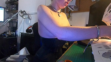 Dutifully working away sewing face masks while plugged and corseted, with a tight hobble skirt on and my wrists chained toget...