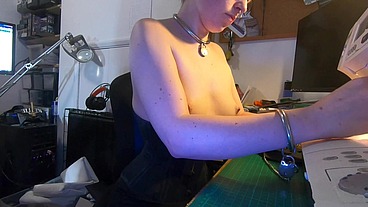 Dutifully working away sewing face masks while plugged and corseted, with a tight hobble skirt on and my wrists chained toget...