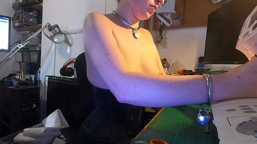 Dutifully working away sewing face masks while plugged and corseted, with a tight hobble skirt on and my wrists chained toget...