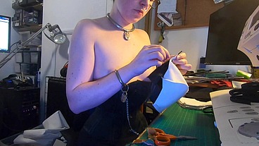 Dutifully working away sewing face masks while plugged and corseted, with a tight hobble skirt on and my wrists chained toget...