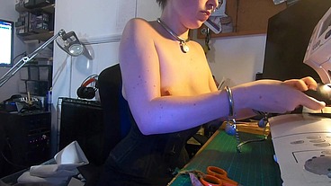 Dutifully working away sewing face masks while plugged and corseted, with a tight hobble skirt on and my wrists chained toget...