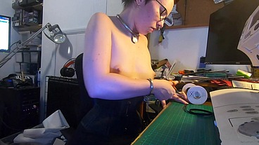 Dutifully working away sewing face masks while plugged and corseted, with a tight hobble skirt on and my wrists chained toget...