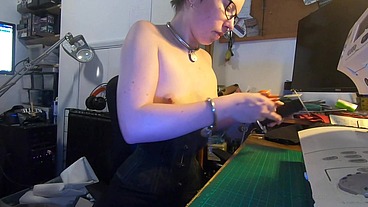 Dutifully working away sewing face masks while plugged and corseted, with a tight hobble skirt on and my wrists chained toget...