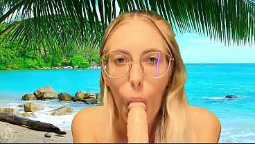 She sucks dildo on beach