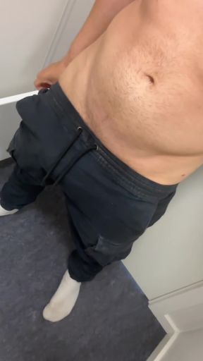 Shirtless man in blue sweatpants