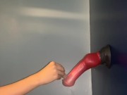 Lubing up and rubbing a dildo with her feet