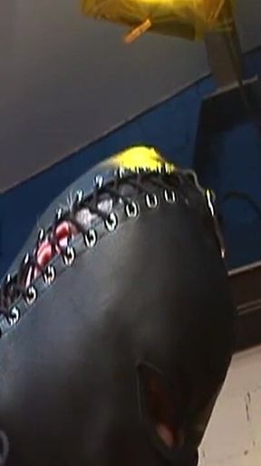 Dominatrix Trains Hooded Slave with Huge Dildo