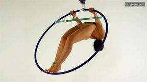 Brunette Kim Nadara in yellow socks doing acrobatics