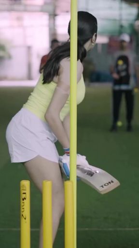 Woman playing cricket