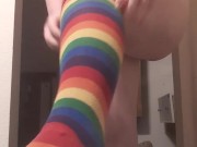 tranny tries on rainbow socks