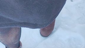 Tempest Jones in fishnet walking down stairs