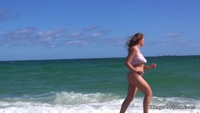 Huge tits beauty running on the beach