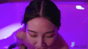Chinese brunette Li Er gets a hot blowjob and handjob in the bathroom