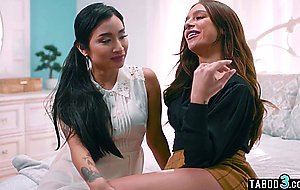 Lesbian couple Avery Black and April Olsen testing the bed in an open house