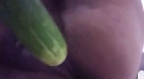 Wife plays with cucumber