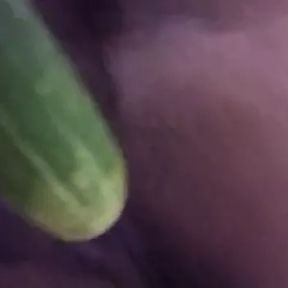 Wife plays with cucumber