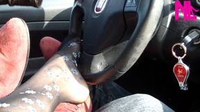 Footsie in the car in black floral pantyhose