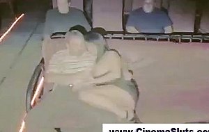 Exhibitionist gangbang in a porn cinema