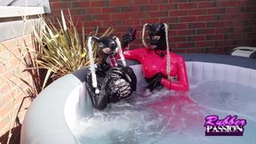 Hot tub fun with lesbian latex lovers
