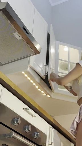Memorable moment from &quot;Super hot big tits beautiful sexy latina in the kitchen prepares coffee with a backless kitchen apron&quot;