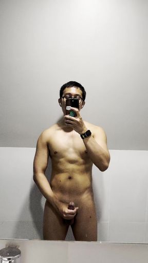 Gym solo amateur stands tall in workout gear