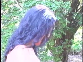 Dude is on his knees sucking horny shemale's dick before he rides her in a park