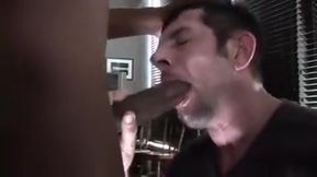 Passionately sucking a big black cock