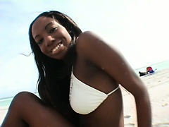 Ebony beach babe goes in for a big dick blowjob and gets her cunny plowed