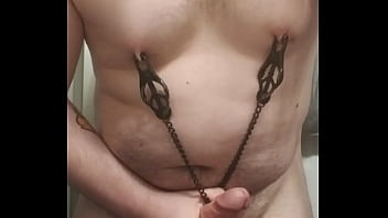 Chubby boy cumming while playing with nipple clamps