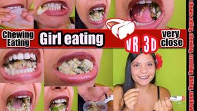 3D VR  Virtual Reality Pretty girl eats a sandwich with boiled ham and very hard corn kernels that crack hard shows you her teeth and her mouth with her sharp teeth