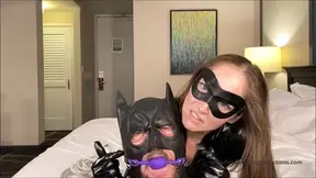 Catwoman captures Batman to be used as her new toy