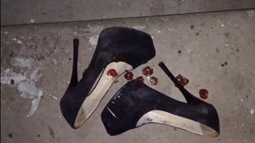 Broken and wrecked black high heels, high heels ruined, messy heels