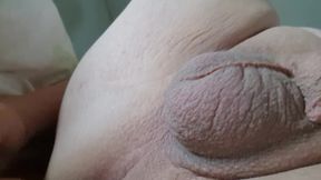 Sissy fucks herself naked on the sofa with a penis plug in the cunt and it brings her fun
