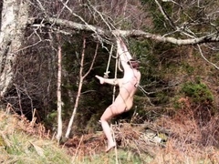 Naked self-bondage in the woods gone wrong.