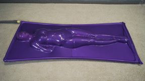 Purple vacuum bed with rope bondage and vibro belt