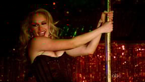 Leven lets her nip hang out during a strip tease.
