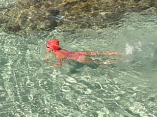 Pink bikini in a beautiful bay