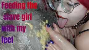 Madame Agatha feeding the slave with her feet