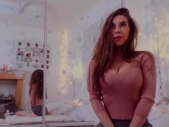 Busty babe playing with her big boobs